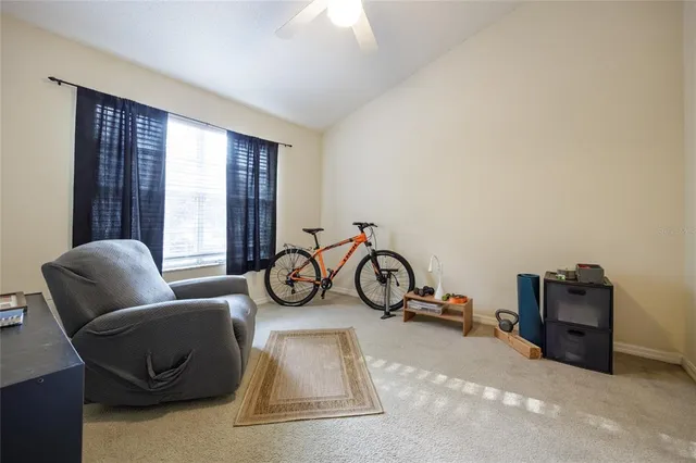 a view of a livingroom with furniture and windows