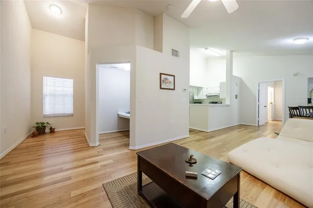 a view of kitchen with furniture and wooden floor