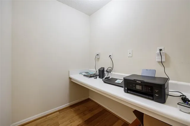 a room with a sink and cabinets