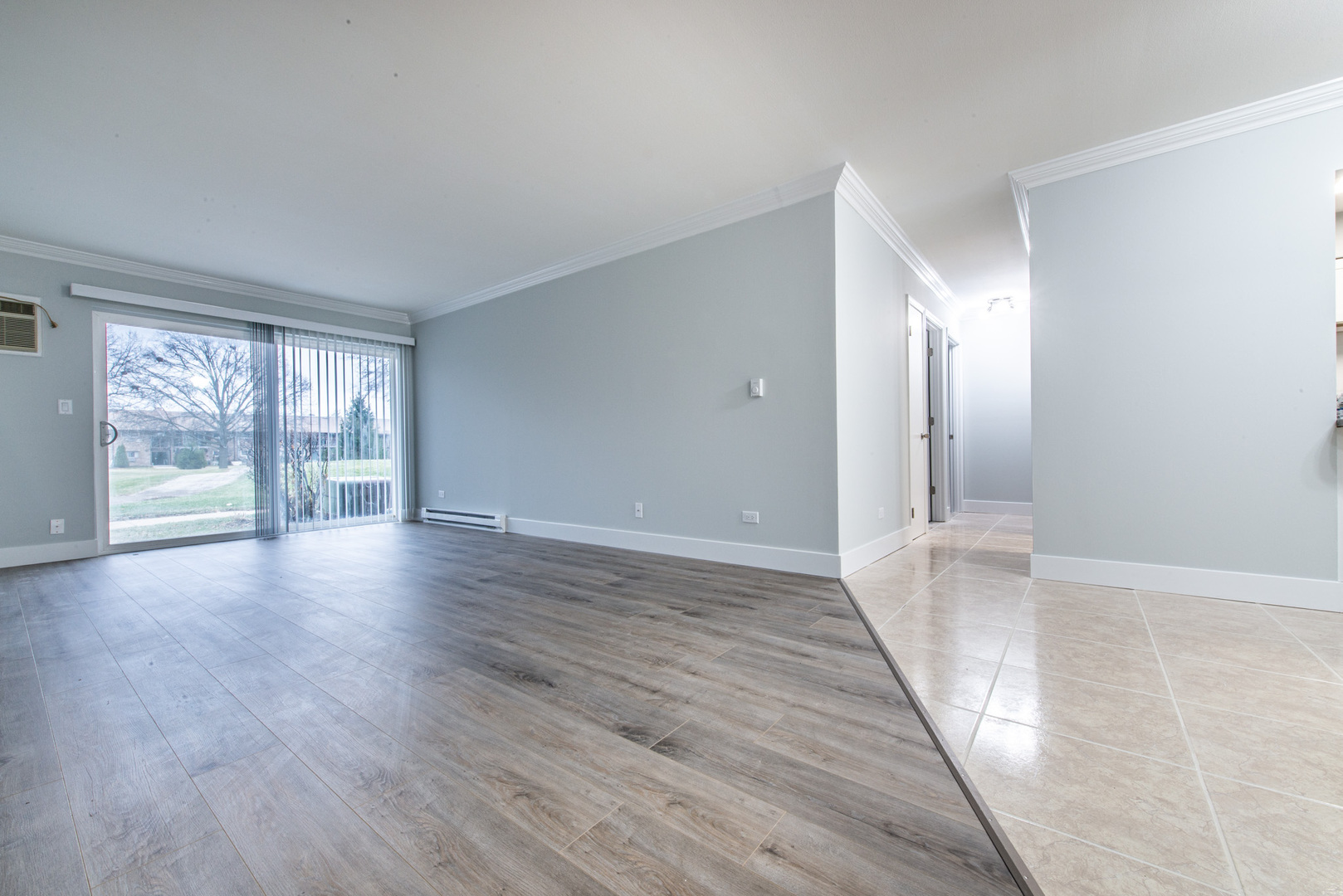 814 East Old Willow Road, Unit 109 Prospect Heights, IL 60070 - Photo 14 of 36 wooden floor in an empty room with a window