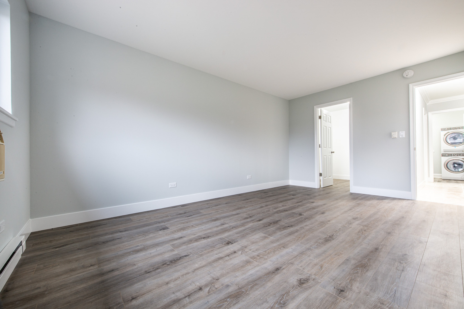 814 East Old Willow Road, Unit 109 Prospect Heights, IL 60070 - Photo 20 of 36 a view of an empty room with wooden floor
