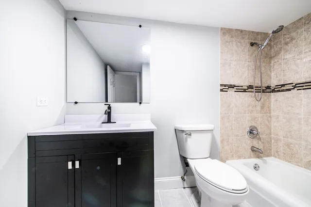 a bathroom with a shower and a shower head