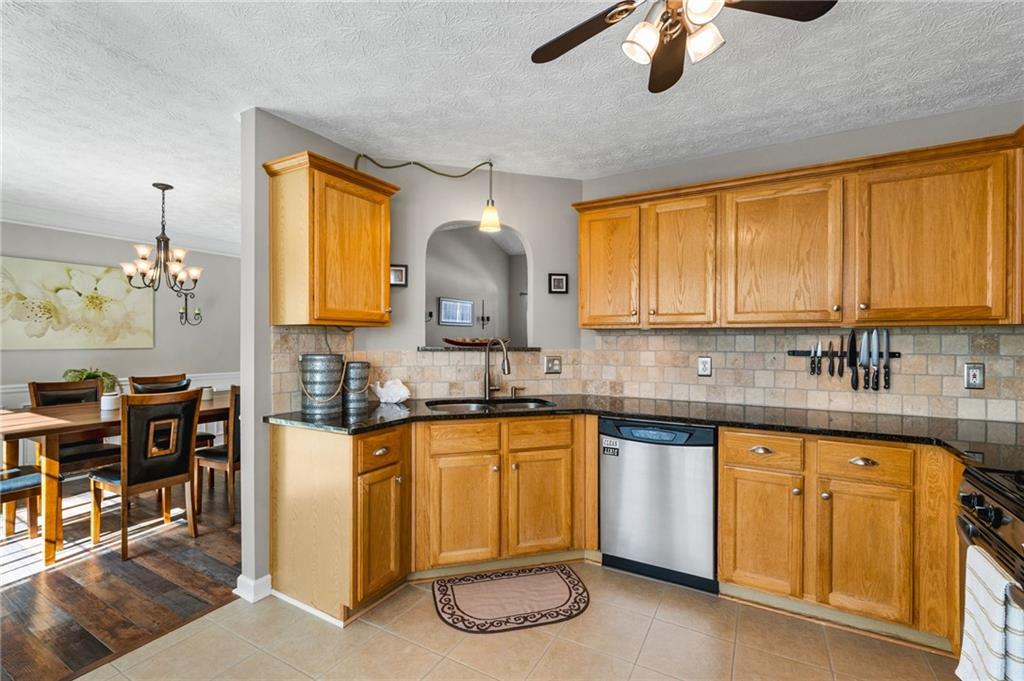202 Weatherstone Crossing Woodstock, GA 30188 - Photo 13 of 29 a kitchen with cabinets a sink and appliances