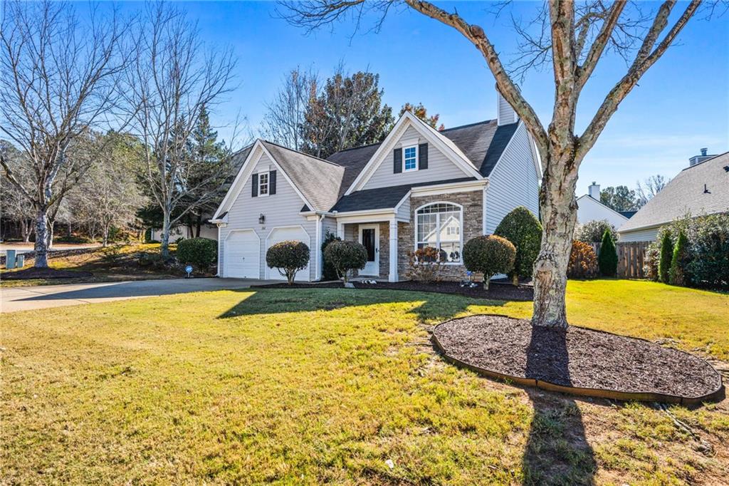 202 Weatherstone Crossing Woodstock, GA 30188 - Photo 2 of 29 a front view of a house with swimming pool