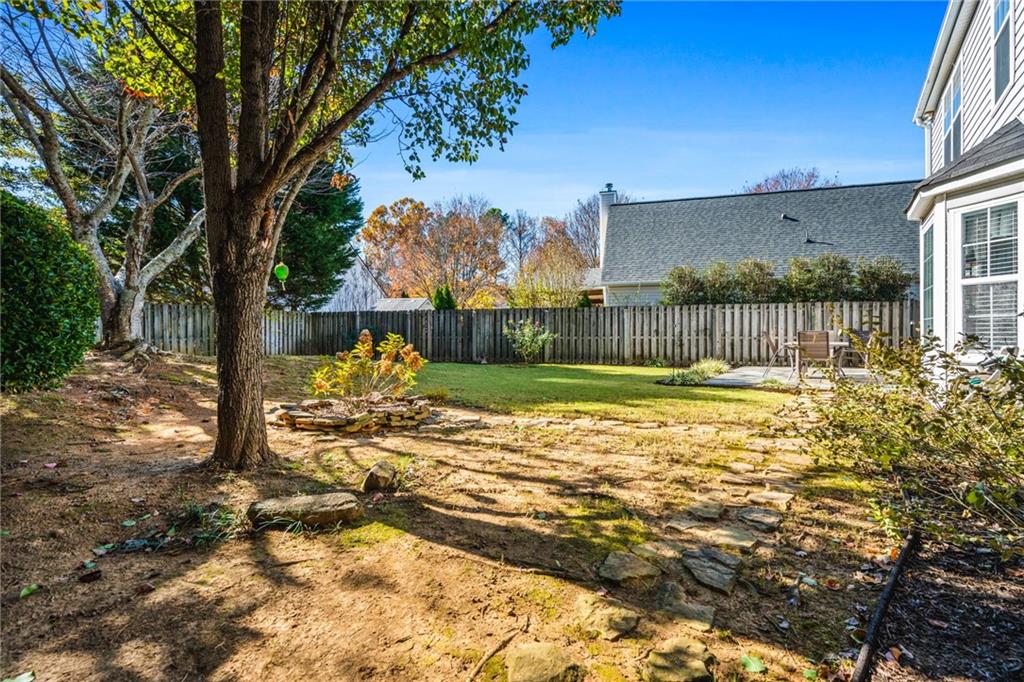 202 Weatherstone Crossing Woodstock, GA 30188 - Photo 28 of 29 a view of yard with swimming pool and patio