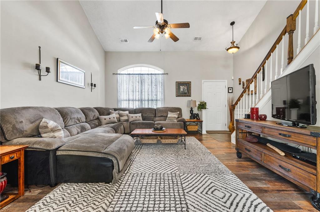 202 Weatherstone Crossing Woodstock, GA 30188 - Photo 6 of 29 a living room with furniture or couch and a flat screen tv
