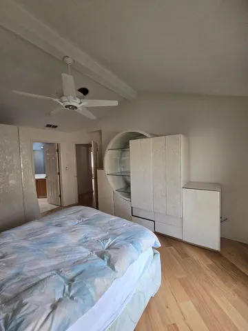 a large white bed in a white room