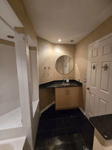 a bathroom with a sink and a mirror