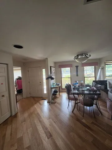 a view of a livingroom with furniture and window