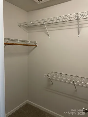 a view of a room with racks on the wall