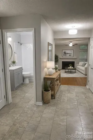 a view of a livingroom with a fireplace and cabinet
