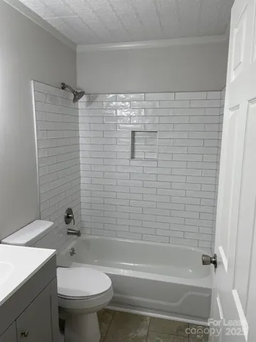 a bathroom with a shower and a toilet