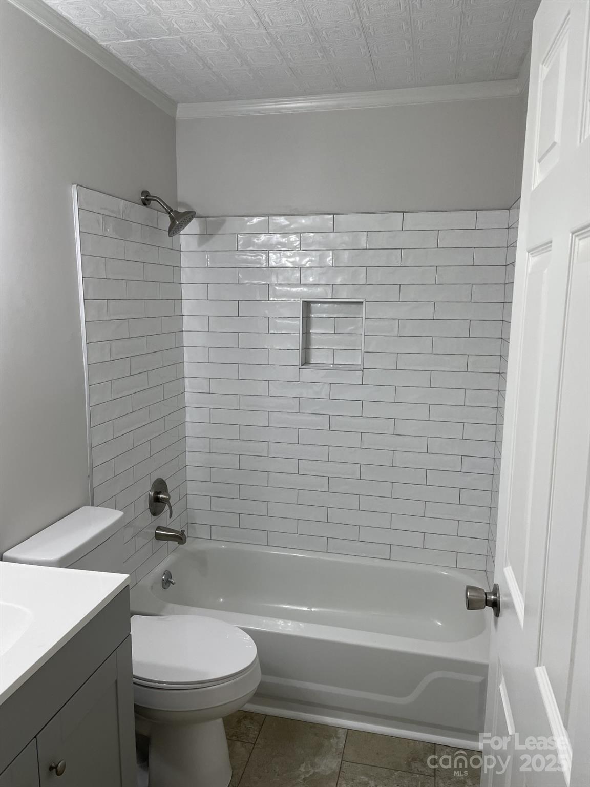 19831 Henderson Road, Unit E Cornelius, NC 28031 - Photo 21 of 23 a bathroom with a shower and a toilet