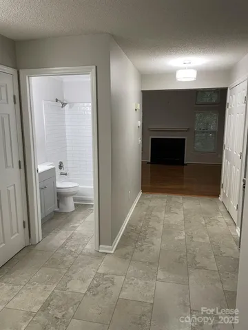 a view of a room with a fireplace and a fireplace