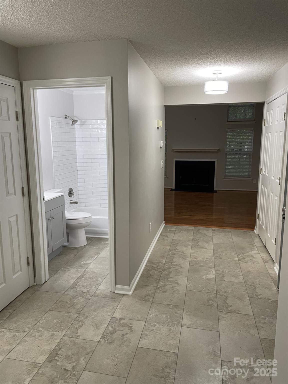 19831 Henderson Road, Unit E Cornelius, NC 28031 - Photo 22 of 23 a view of a room with a fireplace and a fireplace