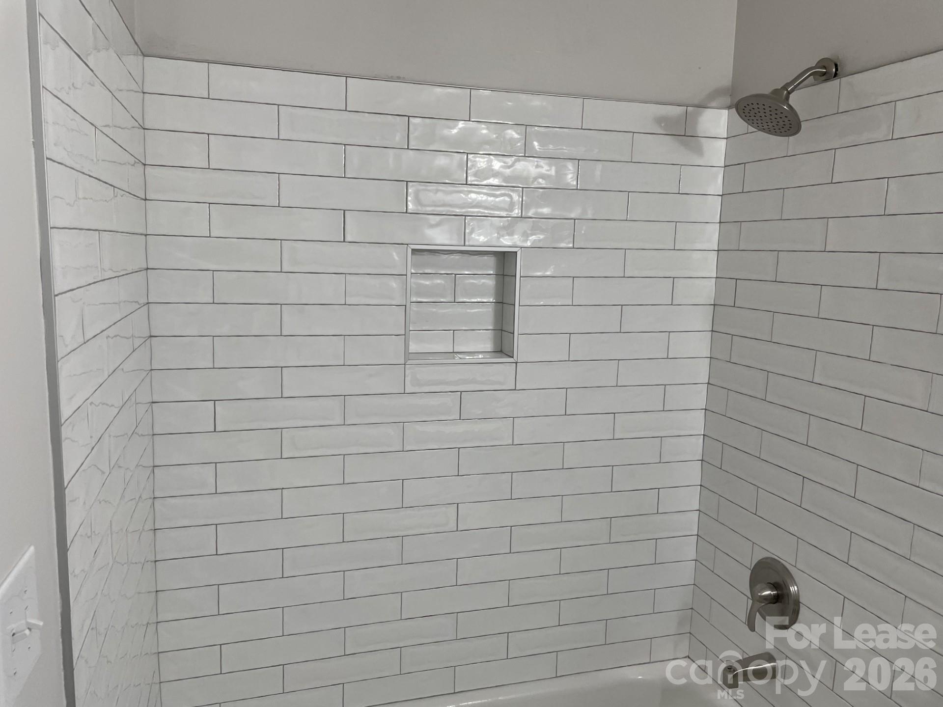 19831 Henderson Road, Unit E Cornelius, NC 28031 - Photo 23 of 27 a bathroom with a shower