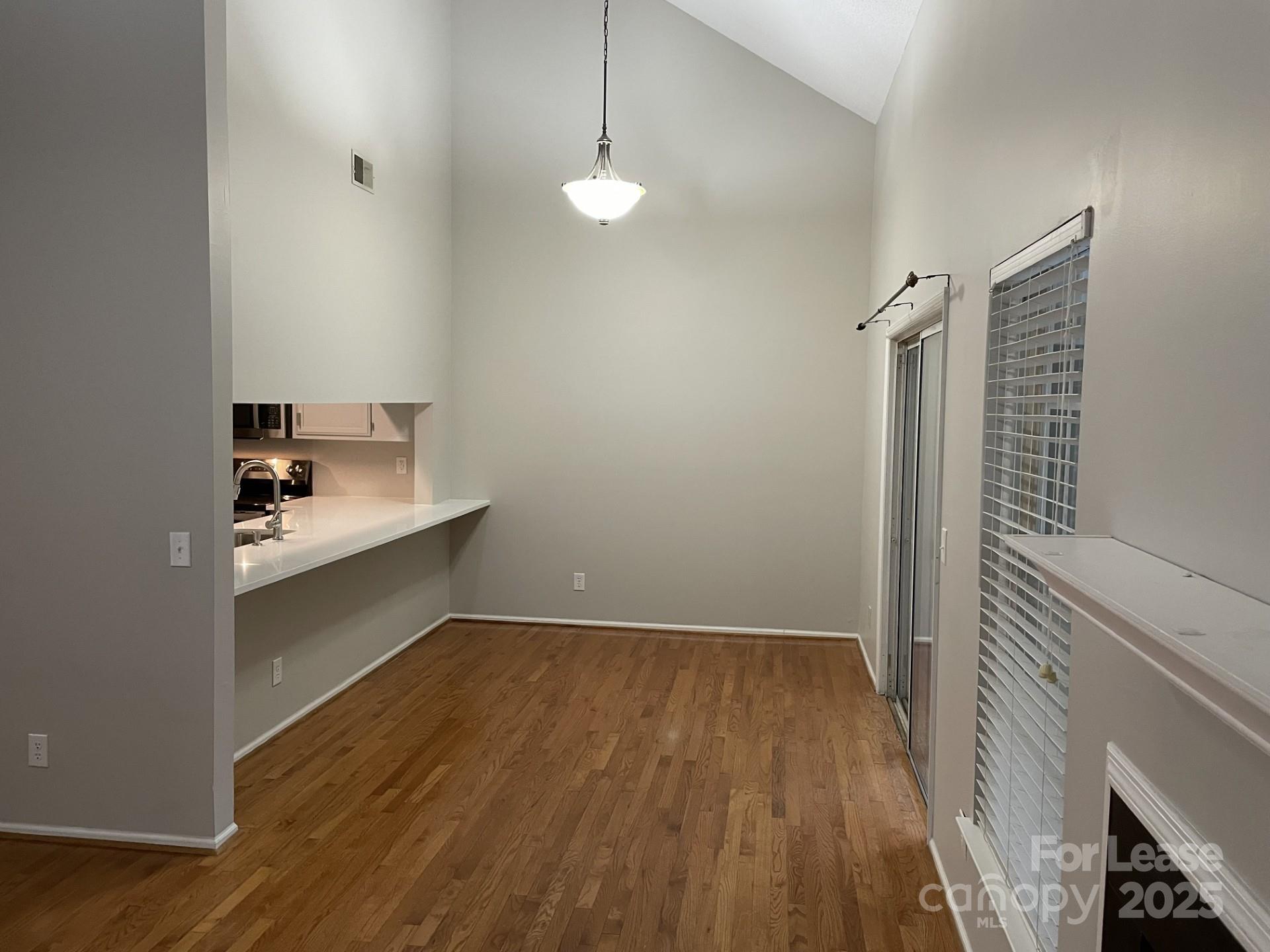 19831 Henderson Road, Unit E Cornelius, NC 28031 - Photo 7 of 23 a bathroom with a sink and a mirror