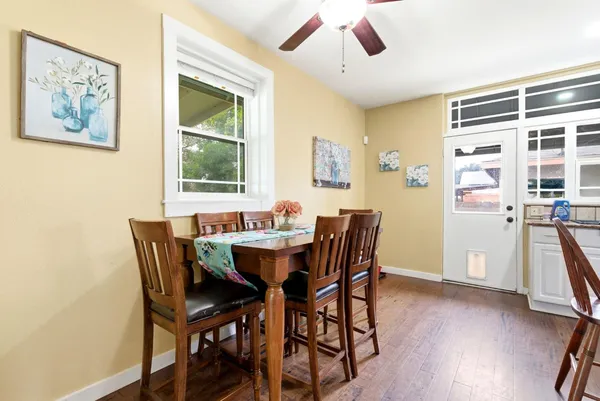 a view of a dining room with furniture window and wooden floor