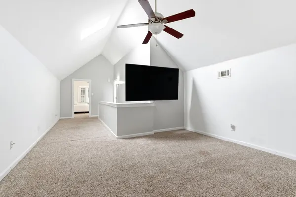 a living room with furniture a rug and a chandelier