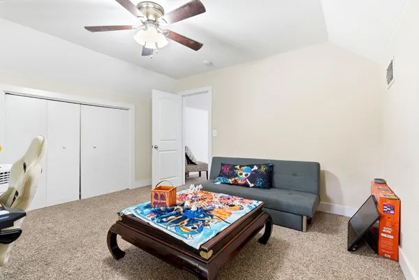 view of a white house with a yard