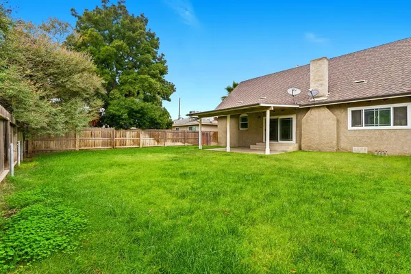 an aerial view of a houses and an outdoor space