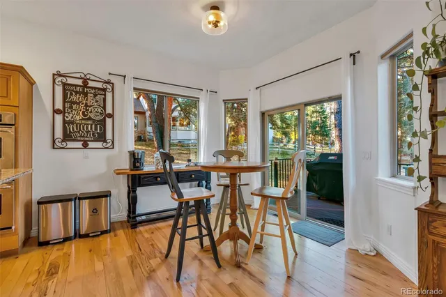 a view of a dining room with furniture window and outside view