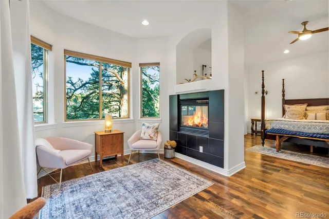 a living room with furniture rug and window
