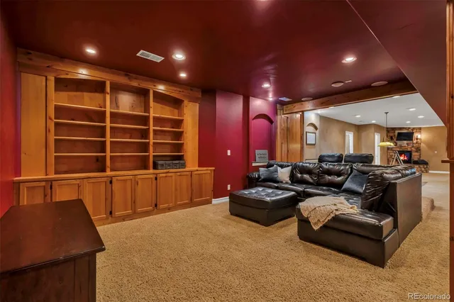 a kitchen with a sink and chairs