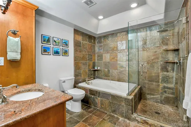 a big room with windows and a ceiling fan