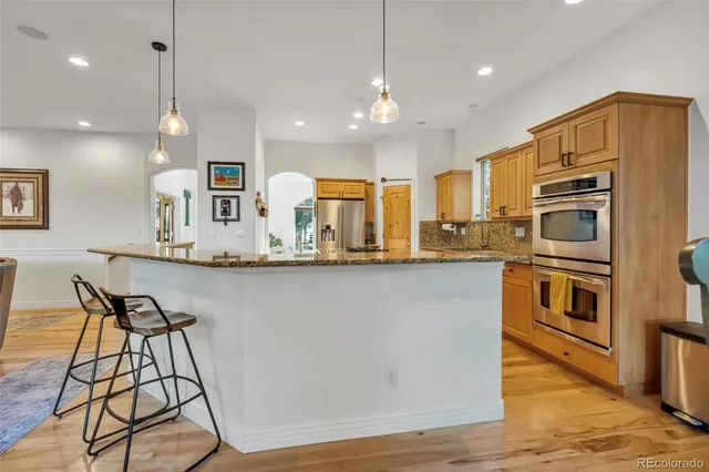 a view of a dining room with furniture and window