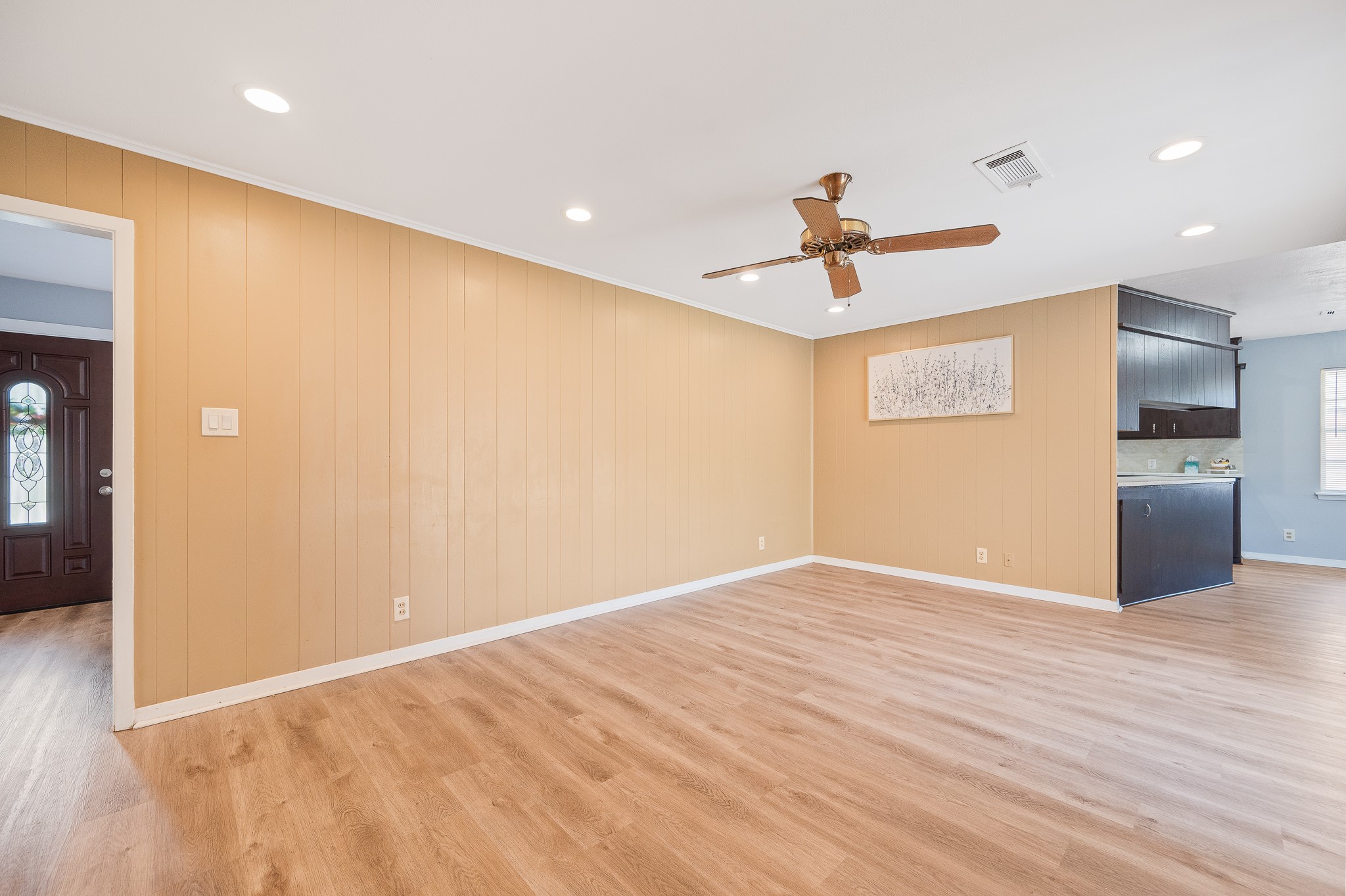 8314 Edgemoor Drive Houston, TX 77036 - Photo 11 of 34 wooden floor in an empty room with a window