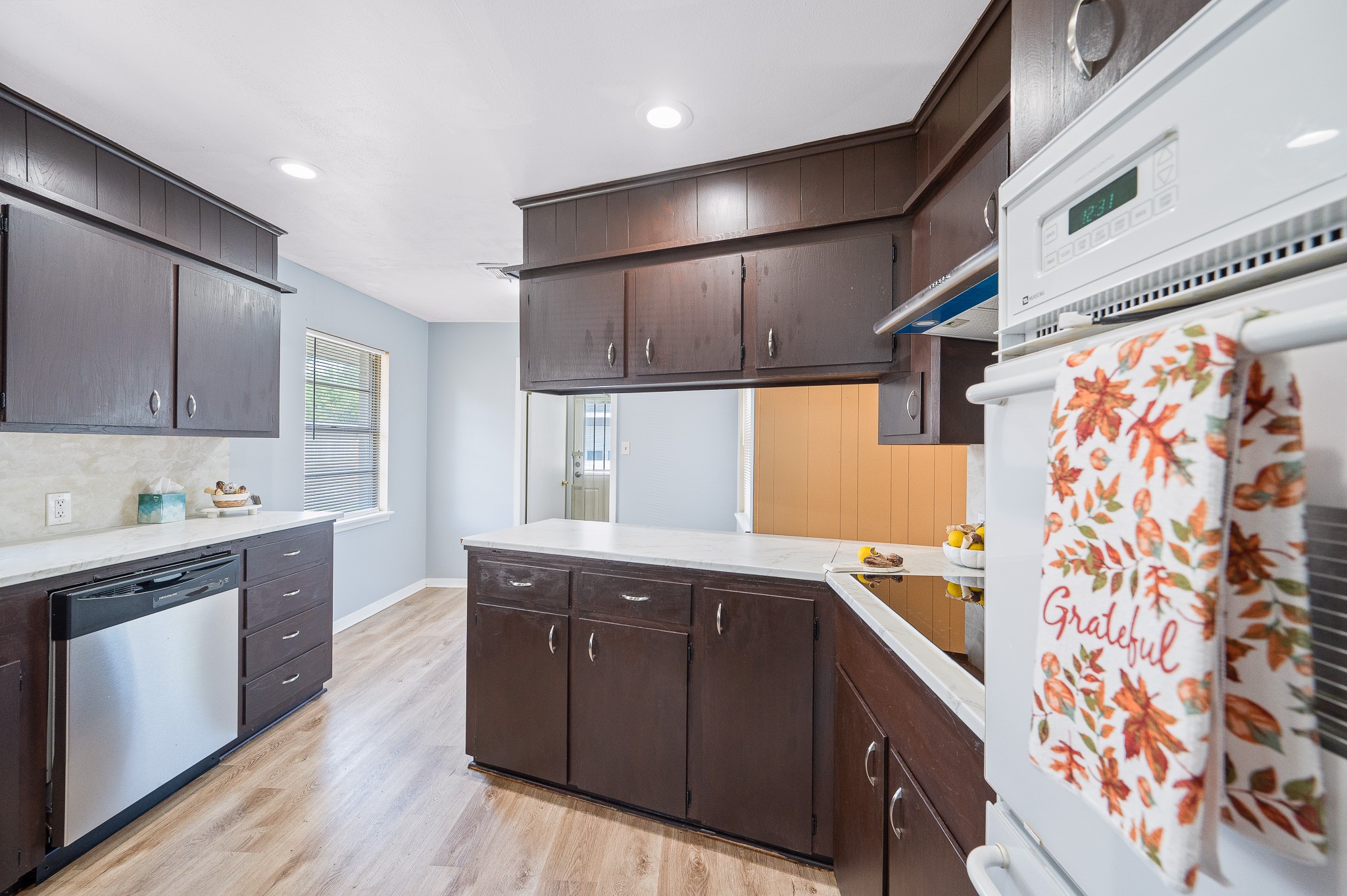 8314 Edgemoor Drive Houston, TX 77036 - Photo 16 of 34 a kitchen with stainless steel appliances granite countertop a sink and wooden cabinets