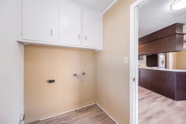 a view of cabinets and wooden floor