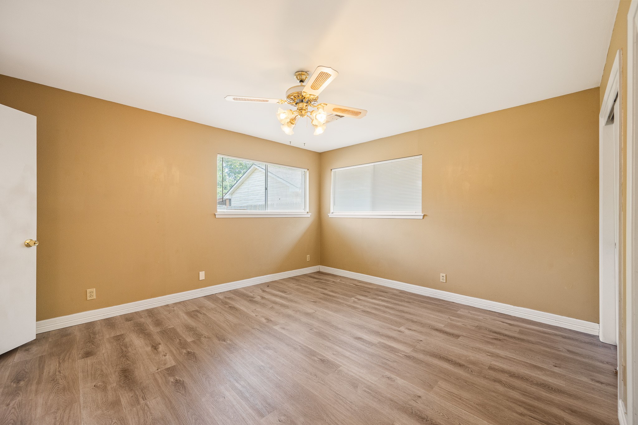 8314 Edgemoor Drive Houston, TX 77036 - Photo 27 of 34 a view of an empty room with window and wooden floor