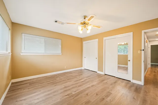 a view of an empty room with a window