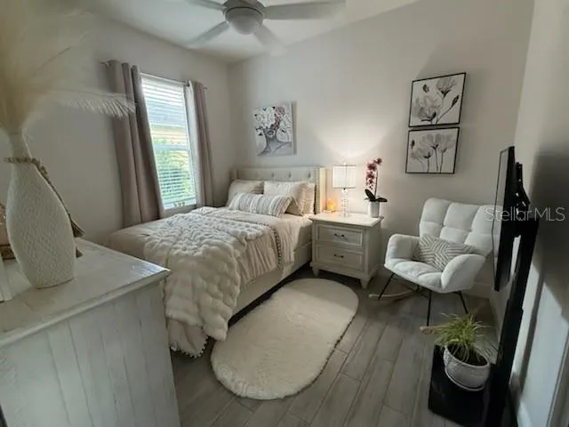 a bedroom with a bed and a couch