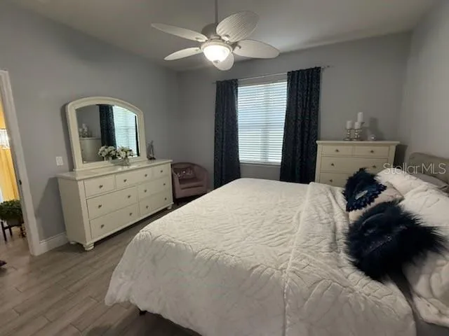 a bedroom with a bed and a dresser