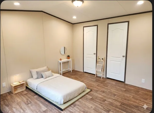 a bedroom with a bed and a table