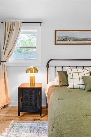 a bedroom with a bed and window