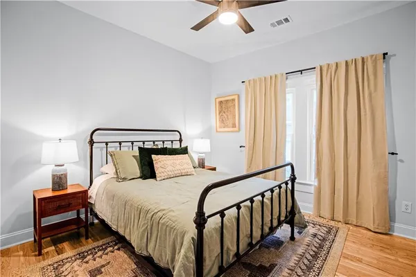 a bedroom with bed and a window