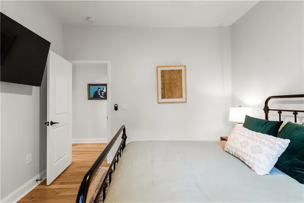 a view of a livingroom with furniture and a flat screen tv