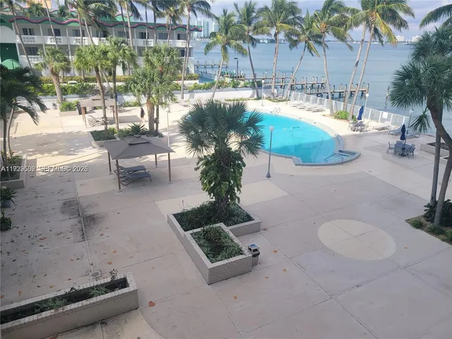 a view of a lake with a palm tree