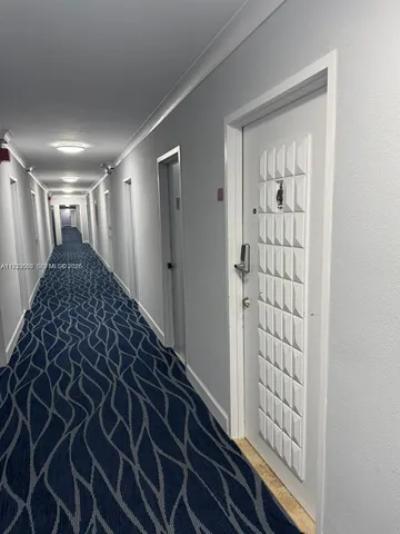 a bathroom with a sink a toilet a window and tub