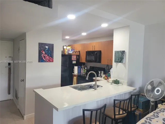 a bedroom with furniture and a wooden floor