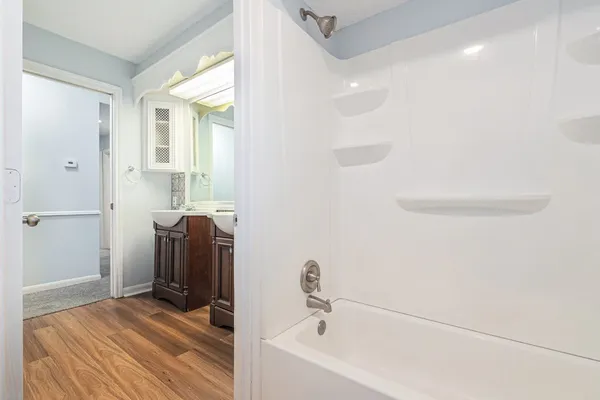 a bathroom with a bathtub and a shower
