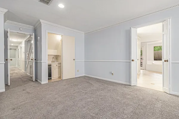 a spacious bathroom with a shower and a sink