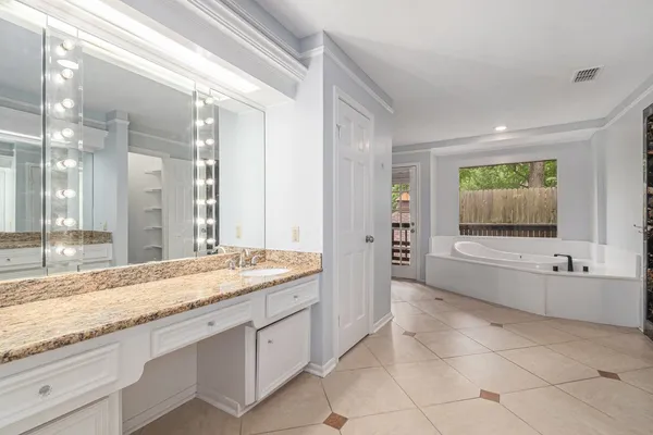 a bathroom with a bathtub and a sink