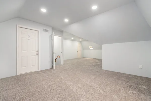 a front view of house with a garden and plants