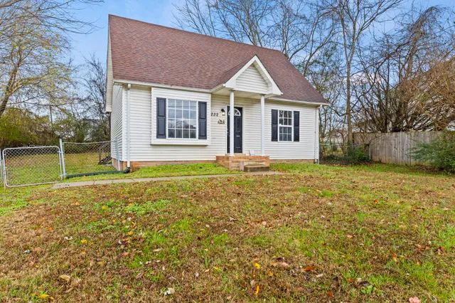 front view of a house with a yard