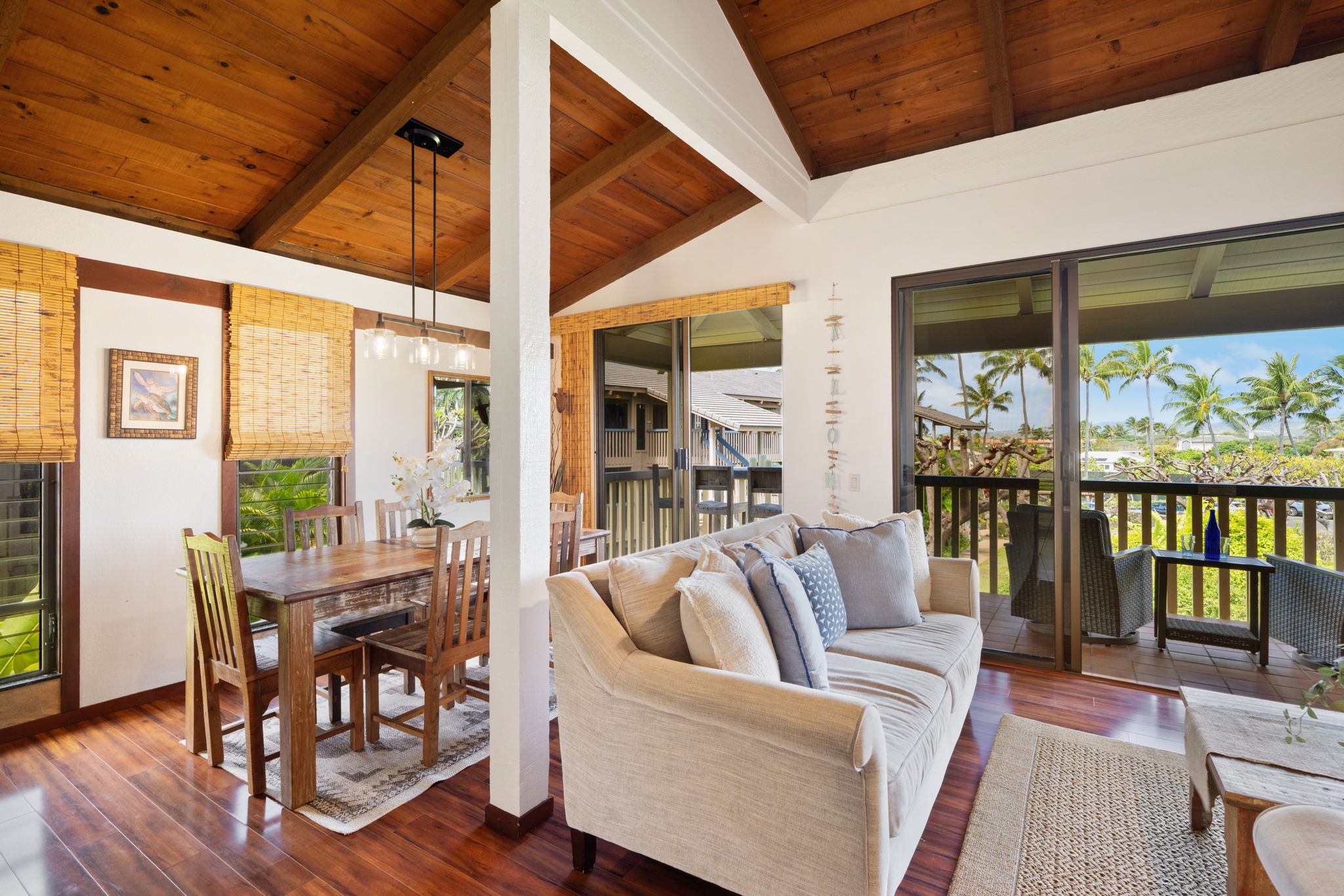 1870 Hoone Road, Unit 600 Koloa, HI 96756 - Photo 13 of 30 a view of a dining room with furniture window and wooden floor